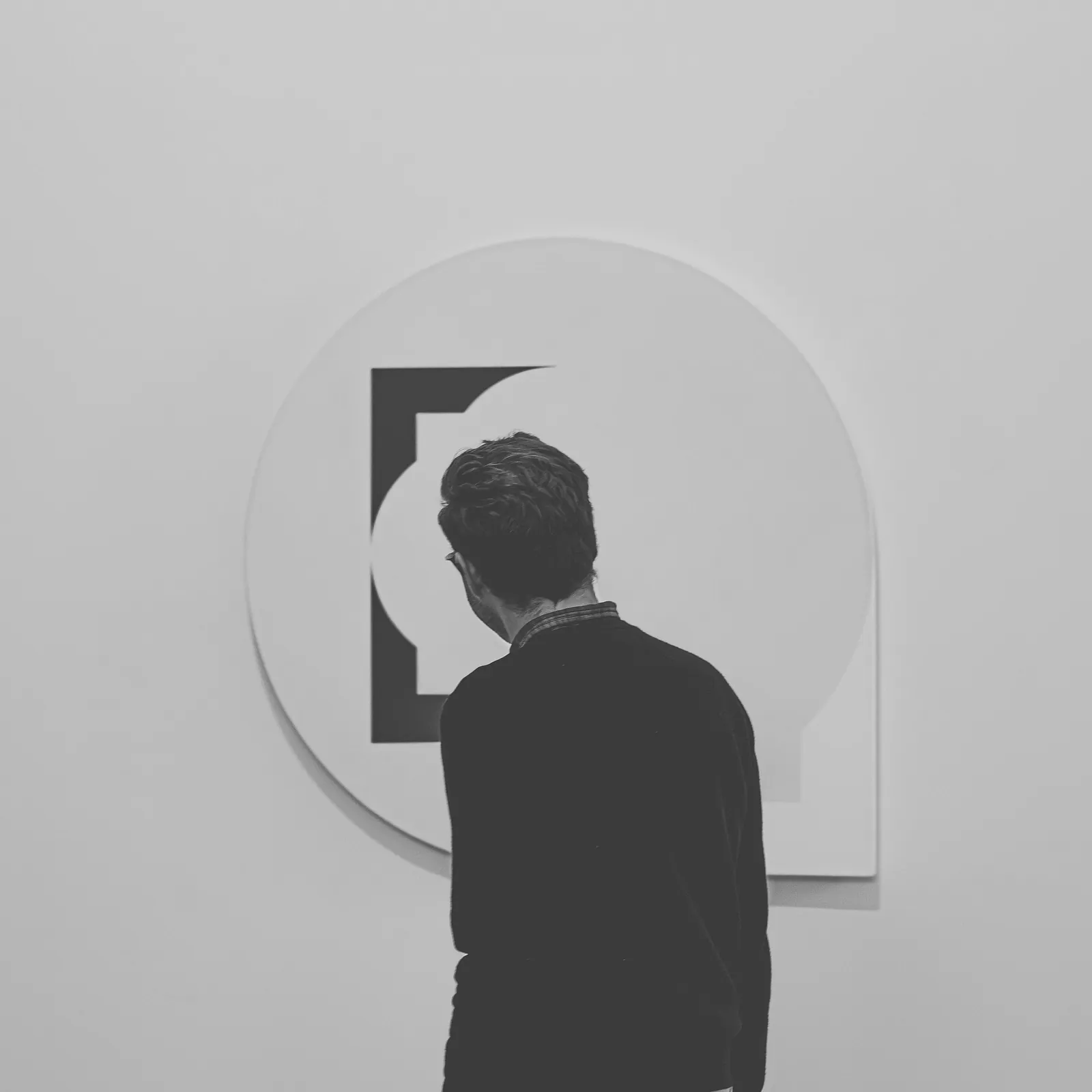 Visitor viewing contemporary artwork in a gallery